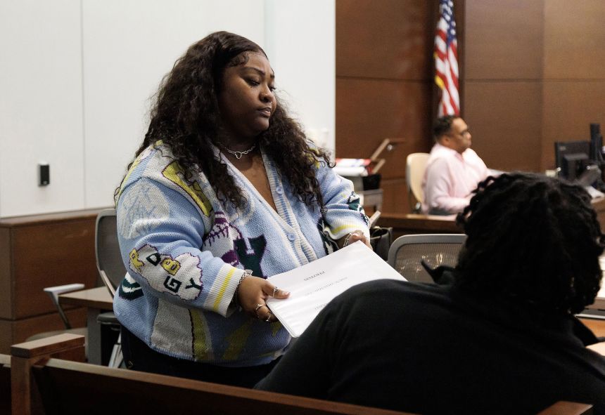 Brenay Kennard, the defendant in the alienation of affection lawsuit, reacts following the announcement of the jury's verdict.