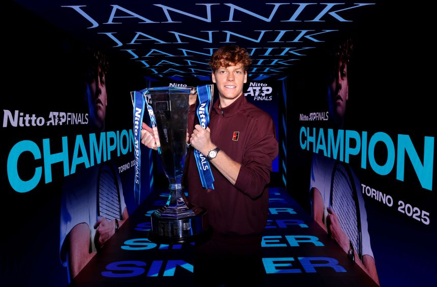Jannik Sinner poses with the ATP Finals trophy after winning the singles title against Carlos Alcaraz in Turin, Italy, on Sunday.