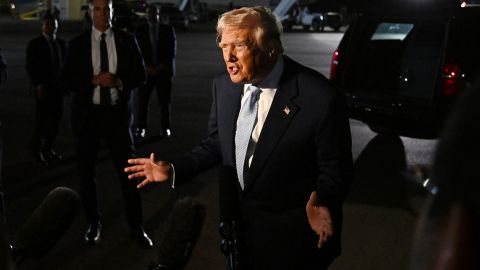 US President Donald Trump speaks to reporters before boarding Air Force One on Sunday, November 16, at Palm Beach International Airport in West Palm Beach, Florida.