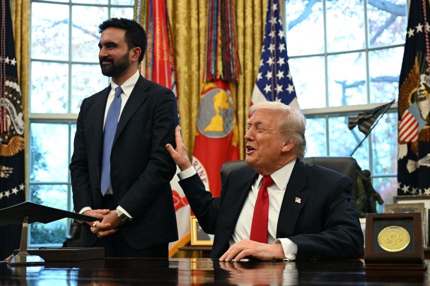 President Donald Trump pats New York Mayor-elect Zohran Mamdani's while they speak to the press in the Oval Office on Friday.