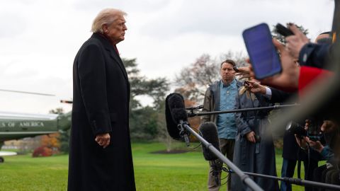 President Donald Trump speaks to reporters as he departs the White House on November 22.