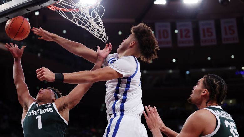 Jeremy Fears Jr. #1 of the Michigan State Spartans goes to the basket as Jasper Johnson #2 of the Kentucky Wildcats defends during the first half in the 2025 State Farm Champions Classic at Madison Square Garden on November 18, 2025 in New York City.