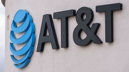 An AT&T logo is displayed outside one of their stores on November 21, in San Diego, California.