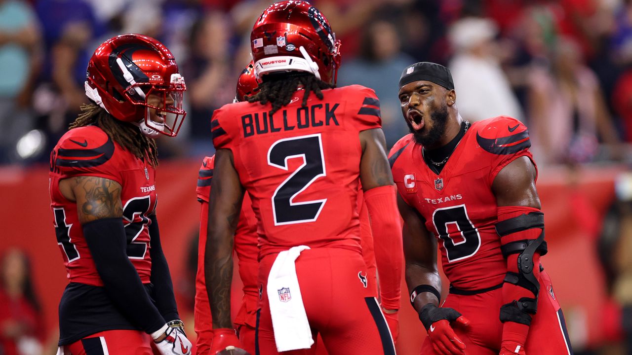 HOUSTON, TEXAS - NOVEMBER 20: Azeez Al-Shaair #0 and Calen Bullock #2 of the Houston Texans celebrate against the Buffalo Bills during the fourth quarter at NRG Stadium on November 20, 2025 in Houston, Texas. (Photo by Tim Warner/Getty Images)
