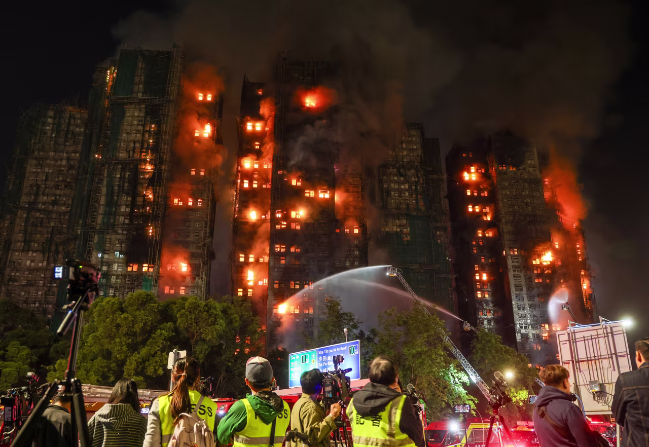 Firefighters tackle a fire engulfing residential buildings at Wang Fuk Court in the Tai Po district of Hong Kong on Wednesday.