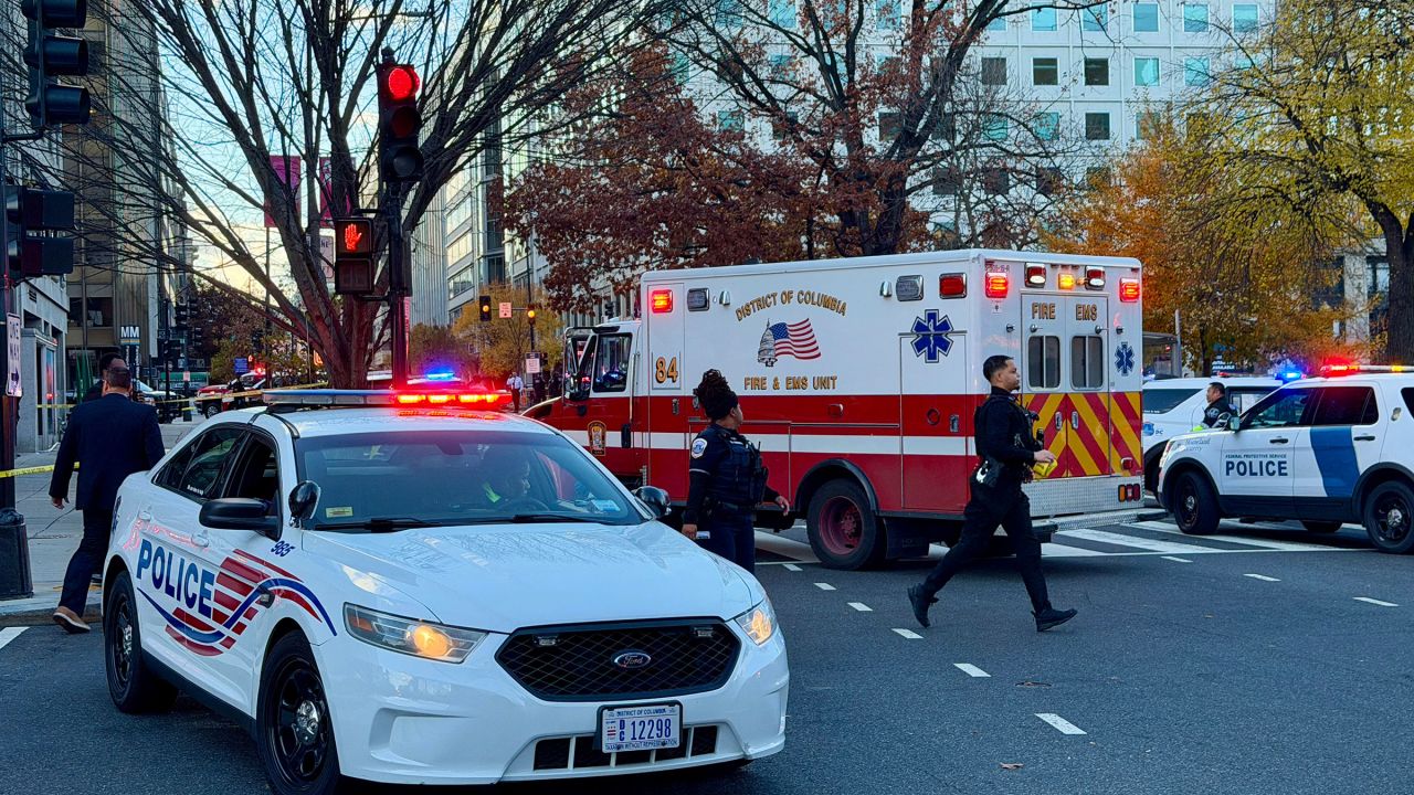 Police and first responders gather near a crime scene after a shooting in downtown Washington, DC, on November 26, 2025. Two members of the National Guard were shot Wednesday just blocks from the White House, according to officials, as a spokesperson for Donald Trump said the president has been briefed on the "tragic situation." Police said they had detained a suspect. (Photo by Daniel SLIM / AFP via Getty Images)