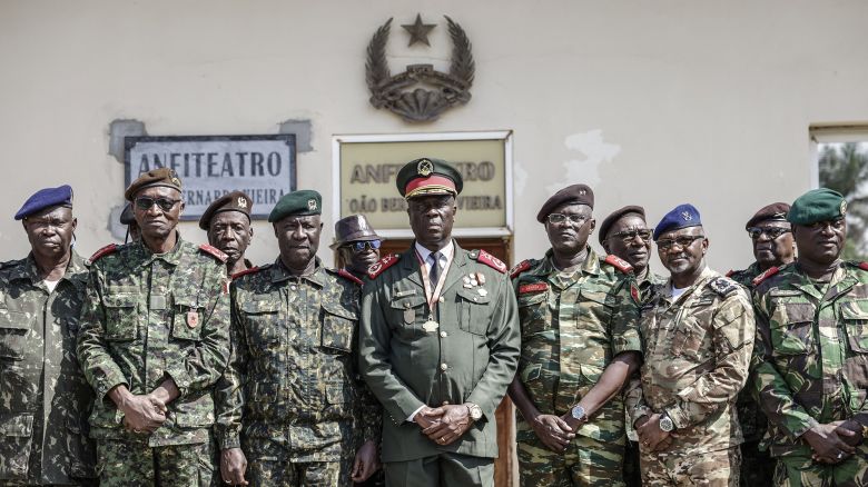 TOPSHOT - Guinea Bissau Army general Horta N'Tam (C) poses with other military leaders after being  sworn in as the transition leader and the leader of the High Command in Bissau on November 27, 2025. The Guinea-Bissau military appointed a general as the country's new leader Thursday for one year, a day after seizing power and arresting the president of the coup-prone west African nation.
"I have just been sworn in to lead the High Command," General Horta N'Tam declared after taking the oath of office in a ceremony at the military's headquarters, AFP journalists observed. Dozens of heavily armed soldiers were deployed at the scene. (Photo by Patrick MEINHARDT / AFP via Getty Images)