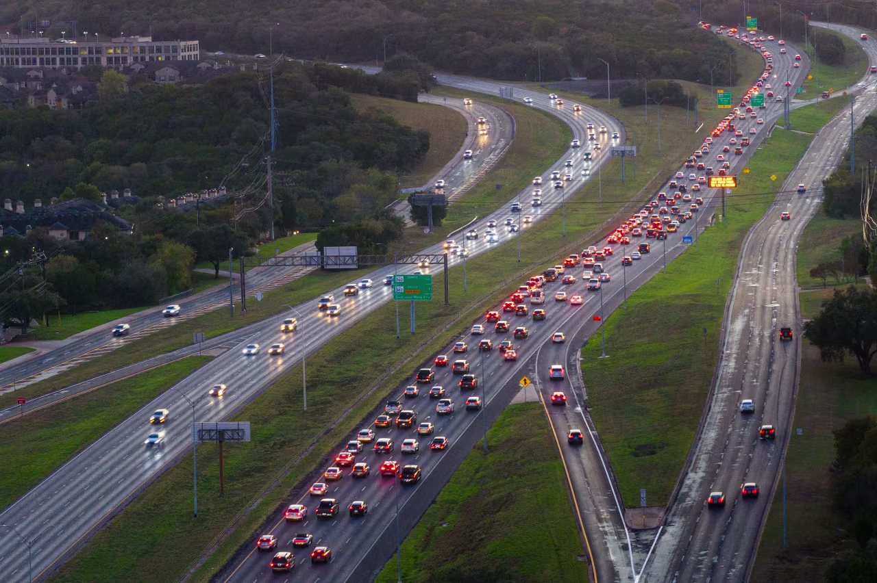 Vehicles move along a highway on November 24 in Austin, Texas.