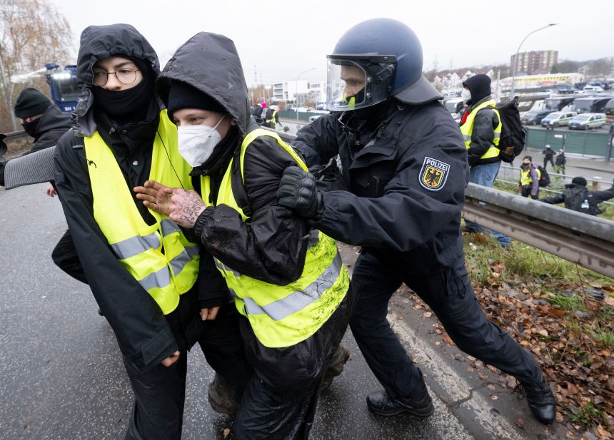 A federal police officer pushes a demonstrator off the street during a demonstration against the establishment of a new AfD youth wing in Gießen, Germany, on Saturday.