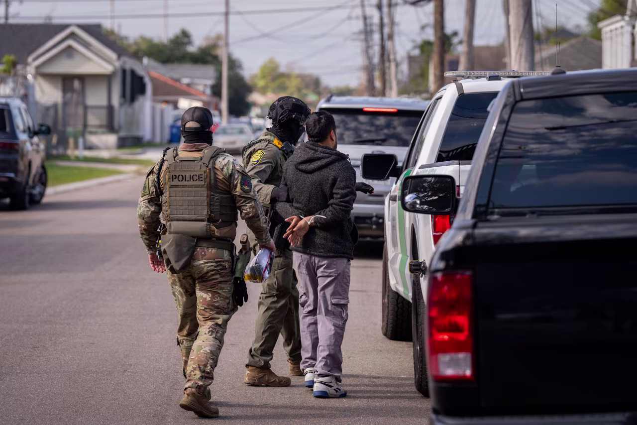 A person is detained by Customs and Border Patrol and other federal law enforcement agents in New Orleans on December 3.