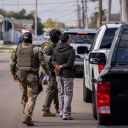 A person is detained by US Customs and Border Patrol (CBP) and other federal law enforcement agents in New Orleans, Louisiana, on December 3, 2025. The US Department of Homeland Security announced on Wednesday it has launched a federal immigration enforcement operation, named "Operation Catahoula Crunch," in the New Orleans, Louisiana, area. (Photo by Adam GRAY / AFP via Getty Images)