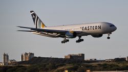An Eastern Airlines plane carrying Venezuelan migrants repatriated from the US lands at Simon Bolivar International Airport in Maiquetia, Venezuela, on December 3, 2025. Venezuela announced on December 2, 2025, that it had reauthorized flights carrying migrants deported by the US, days after suspending them due to President Donald Trump's demand that Venezuelan airspace be considered "closed." (Photo by Juan BARRETO / AFP via Getty Images)