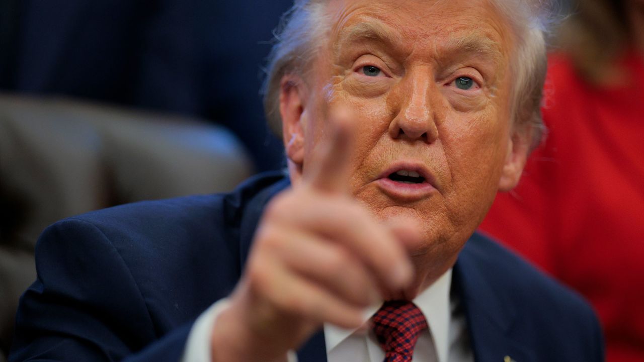 President Donald Trump takes questions from the press in the Oval Office on Wednesday.