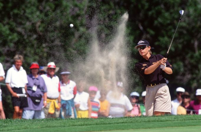 Former pro golfer Annika Sorenstam hits a shot out of the bunker, pictured here, during her first tour win in 1995. "It was a big turning point because all of a sudden it's like ... I felt like I belong out here," she told CNN. <strong>Look through the gallery for more moments from Sorenstam's record-setting career.</strong>