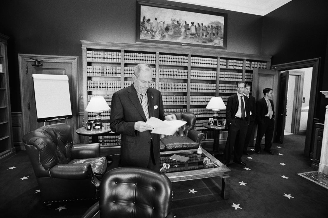 Supreme Court Justice Anthony M. Kennedy stands in his chambers with his clerks during the 2001-2002 term.