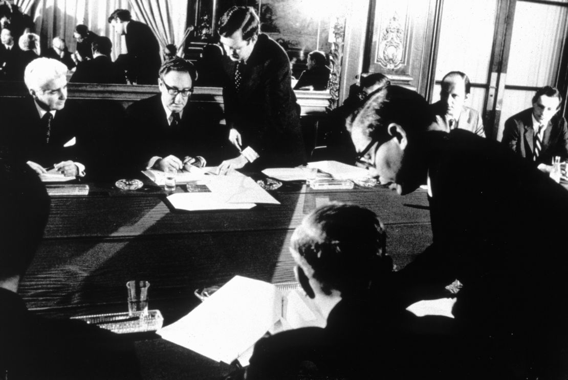 Henry Kissinger and Vietnamese politician Le Duc Tho sign the Paris peace accords that ended the Vietnam War. Both men were awarded the Nobel Peace Prize, though Le Duc Tho refused to accept it.