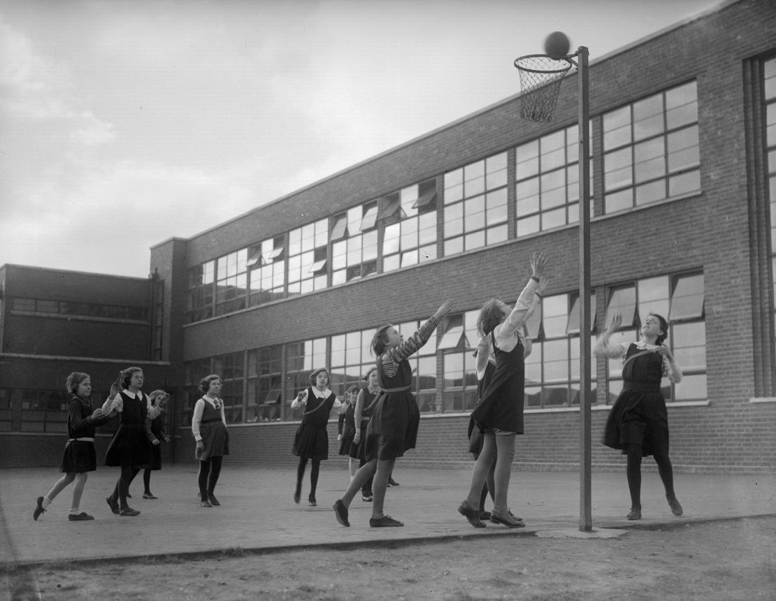 January 1935: Girls playing netball in the playground at Oakington Manor School, Wembley.