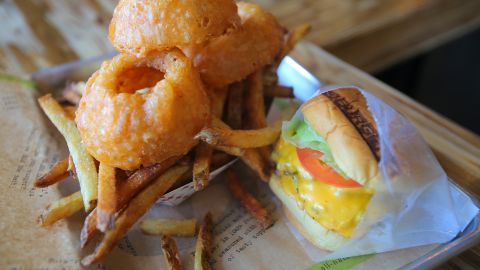 BurgerFi cheeseburger with side of cry and fries (onion rings and fries) at the BurgerFi near Boston University on Commonwealth Avenue.