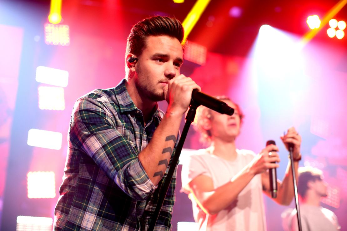 Liam Payne performs on stage with One Direction.