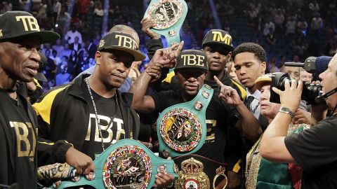 Floyd Mayweather Jr. of the US poses with his belts after beating Marcos Maidana of Argentina on September 13, 2014 at The MGM Grand, Las Vegas. Mayweather dominated with a 12 round unanimous decision over Maidana retaining his WBA Welterweight Belt and WBC Welterweight and Super Welterweight World Titles. (Photo John Gurzinski / AFP) (Photo credit should read JOHN GURZINSKI/AFP via Getty Images)