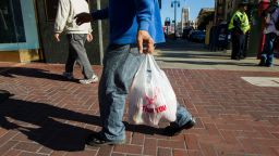 A man carries a plastic shopping bag on September 30, 2014 in San Francisco, California.