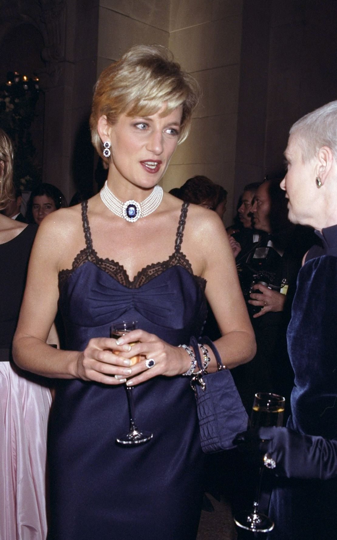 Diana accessorized with sapphire and pearl jewelry full of subtle symbolism.