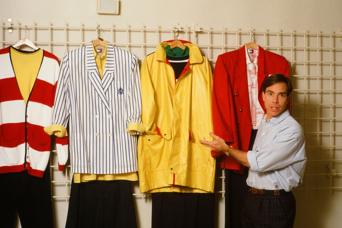 Tommy Hilfiger poses with his designs in his New York studio on September 10, 1987.