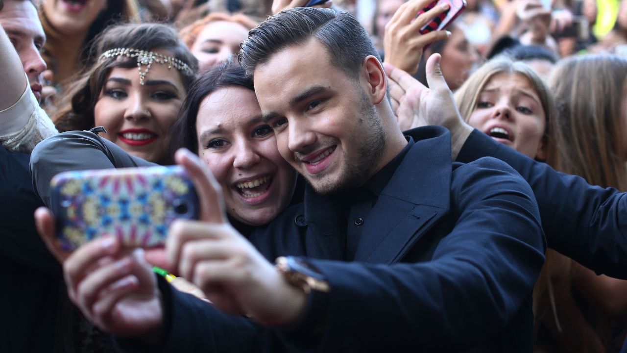 Liam Payne from One Direction takes a selfie with fans in 2014 in Sydney, Australia.