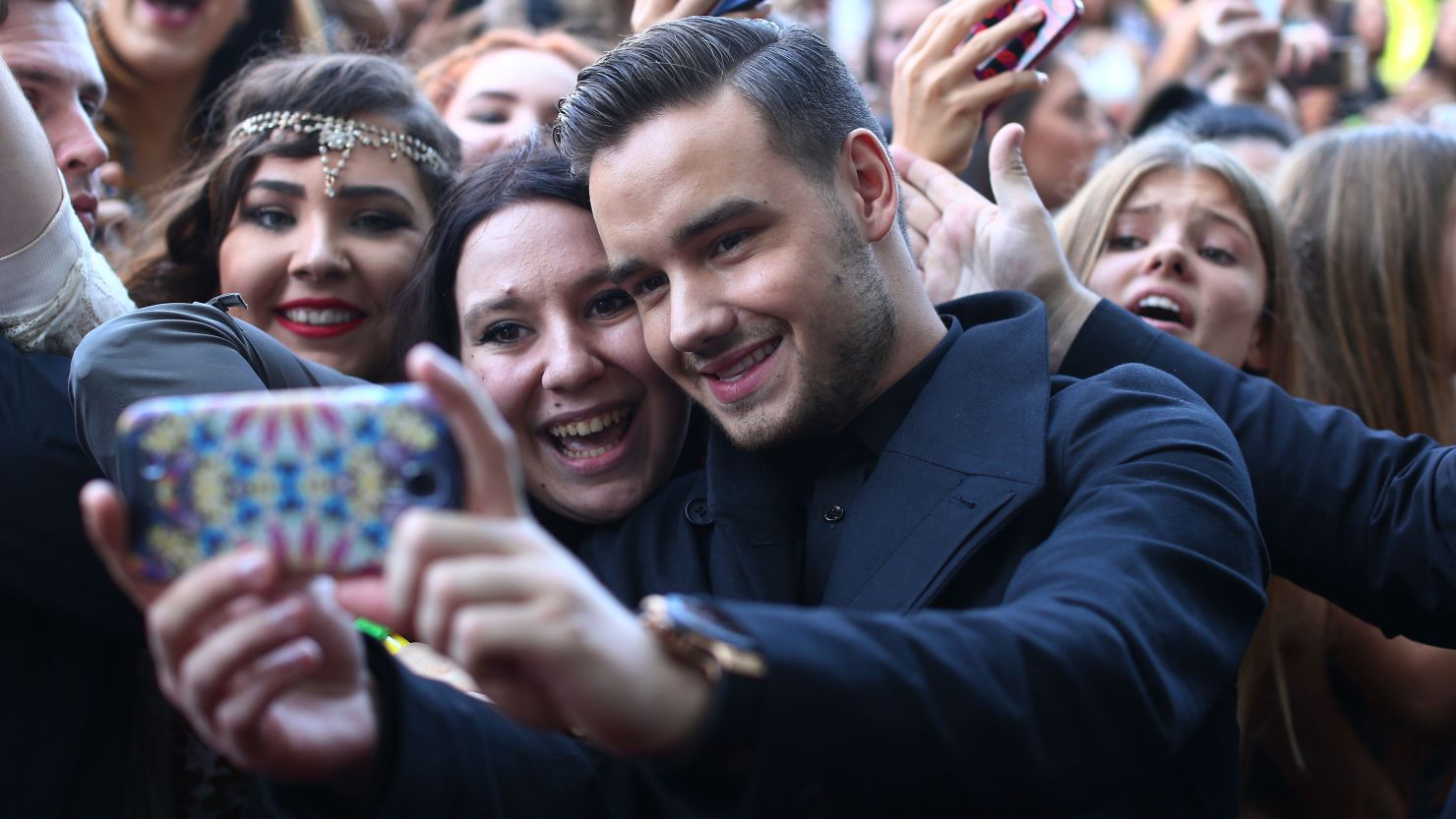 Liam Payne from One Direction takes a selfie with fans in 2014 in Sydney, Australia.