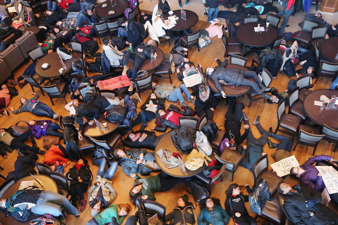 Students stage a "die in" at Washington University to draw attention to police violence against unarmed Black men on December 1, 2014, in St. Louis, Missouri.