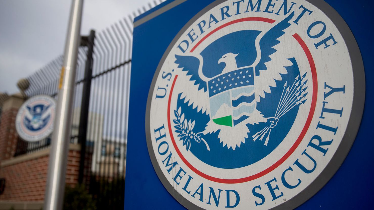 The U.S. Department of Homeland Security (DHS) seal stands at the agency's headquarters in Washington, DC, on Thursday, Dec. 11, 2014.
