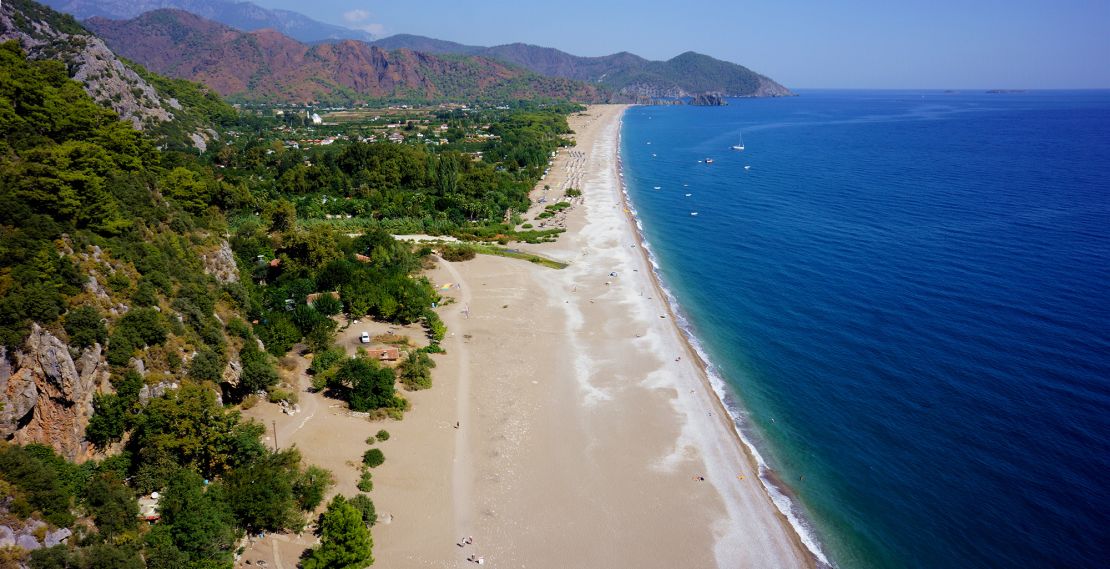 The ancient city of Olympos ends at a long and wide beach.