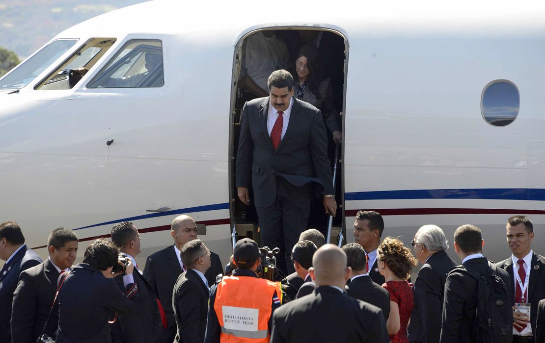 Venezuelan President Nicolas Maduro alights from the plane upon his arrival at the Santa Maria airport, 22 km north of San Jose, on January 28, 2015 to take part in the III CELAC Summit.
