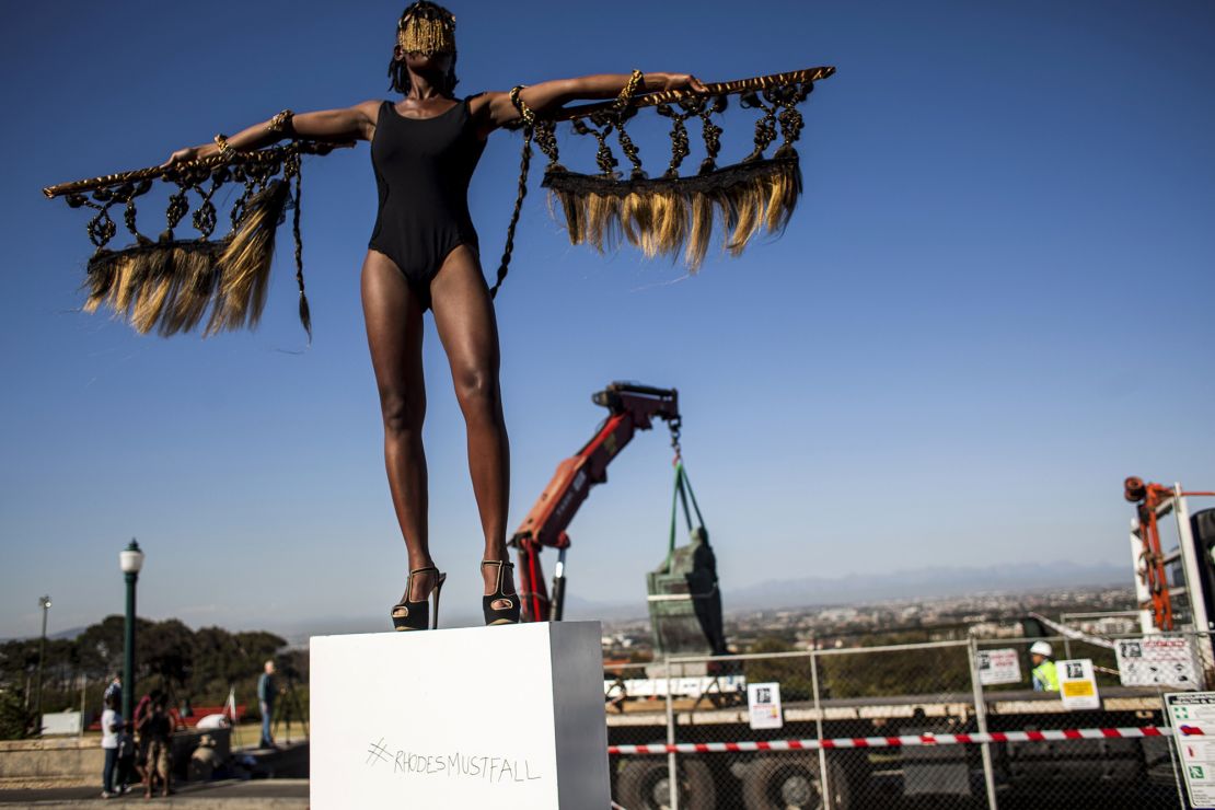 Sethembile Msezane on a plinth in front of the statue of British colonialist Cecil John Rhodes. Its removal was the culmination of a month of protests by students.