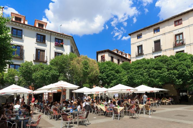 <strong>5. Madrid, Spain: </strong>Locals and visitors enjoying outdoor dining on a Madrid plaza on a sunny day in May.