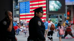 New York Police Officers stand guard at Times Square in New York on July 4, 2015.