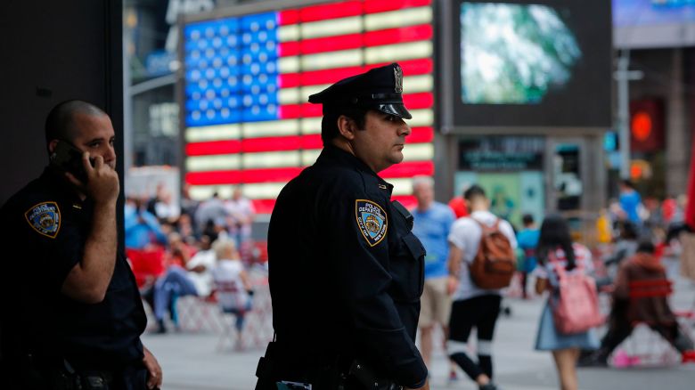 New York Police Officers stand guard at Times Square in New York on July 4, 2015.
