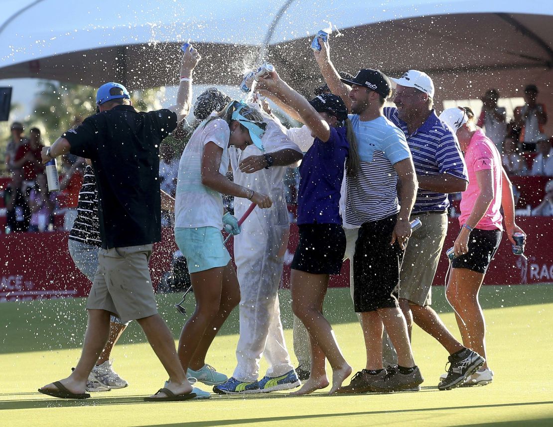 Thompson is drenched after winning her first major in 2014.