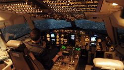 TO GO WITH AFP STORY BY JESSICA LOPEZ ESCURE 
An employee of the SIM Aviation Group, an aviation training organization, checks various controls aboard a flight simulator for Boeing 767-300ER and 757-200 at a training center in Roissy-en-, near Roissy airport on April 7, 2014. Rental professionnal flight simulators, which cost between 10 and 15 million euros, are now open to the public for an experience worth 360 euros. AFP PHOTO / ERIC PIERMONT / AFP / ERIC PIERMONT        (Photo credit should read ERIC PIERMONT/AFP via Getty Images)