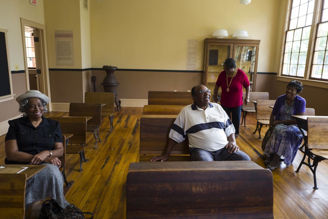 Rosenwald graduates from left, Leonora Gross, 79, Norman Hall, 80, Mae Williams, and Corinthia Ridgley Boone, 80, gather at the Ridgeley School in Capitol Heights, Maryland, in 2015.