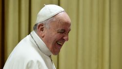 Pope Francis smiles as he arrives for the Synod on the family on October 5, 2015, at the St Peter's basilica in Vatican. Pope Francis on October 4 defended marriage and heterosexual couples as he opened a synod on the family overshadowed by a challenge to Vatican orthodoxy by a gay priest. AFP PHOTO / TIZIANA FABI (Photo credit should read TIZIANA FABI/AFP via Getty Images)