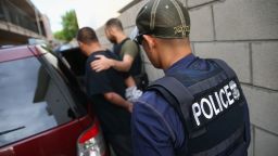 LOS ANGELES, CA - OCTOBER 14:  A man is detained by U.S. Immigration and Customs Enforcement (ICE), agents on October 14, 2015 in Los Angeles, California. ICE agents said the immigrant, holding a Green Card, was a convicted criminal and member of the Alabama Street Gang. ICE builds deportation cases against thousands of immigrants living in the United States. Green Card holders are also vulnerable to deportation if convicted of certain crimes. The number of ICE detentions and deportations from California has dropped since the state ed the Trust Act in October 2013, which set limits on California state law enforcement cooperation with federal immigration authorities.  (Photo by John Moore/Getty Images)