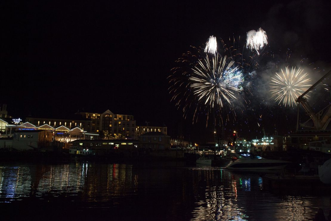 Fireworks light the sky during New Year celebrations in the Victoria & Alfred Waterfront area of Cape Town, South Africa.