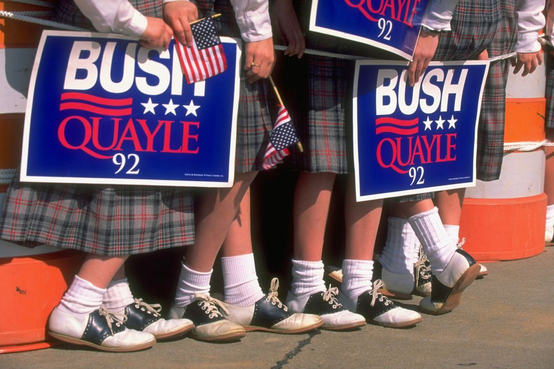 Blue placards supporting Republican candidates George H. W. Bush and Dan Quayle in 1992, by which time CNN, CBS and ABC's electoral maps were all using red for the GOP.