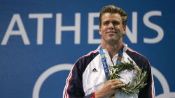 ATHENS - AUGUST 20:  Gary Hall Jr. of the United States listens to the national anthem after receiving the gold medal for the men's swimming 50 metre freestyle event on August 20, 2004 during the Athens 2004 Summer Olympic Games at the Main Pool of the Olympic Sports Complex Aquatic Centre in Athens, Greece. (Photo by Shaun Botterill/Getty Images)