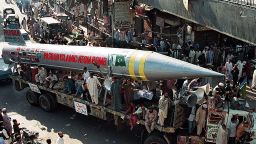 KARACHI, PAKISTAN: A mock missile, dubbed the Pakistan Islamic Atomic Bomb, is paraded through the streets of Karachi by Pasban, a youth wing of the country's main fundamentalist Jamaat-e-Islami, here 05 February, as part of a day of solidarity with Kashmiris in Indian-istered Kashmir. Pasban leaders said the mock missile symbolised Pakistan's nuclear capabilities. AFP PHOTO/Aamir QURESHI (Photo credit should read AAMIR QURESHI/AFP via Getty Images)