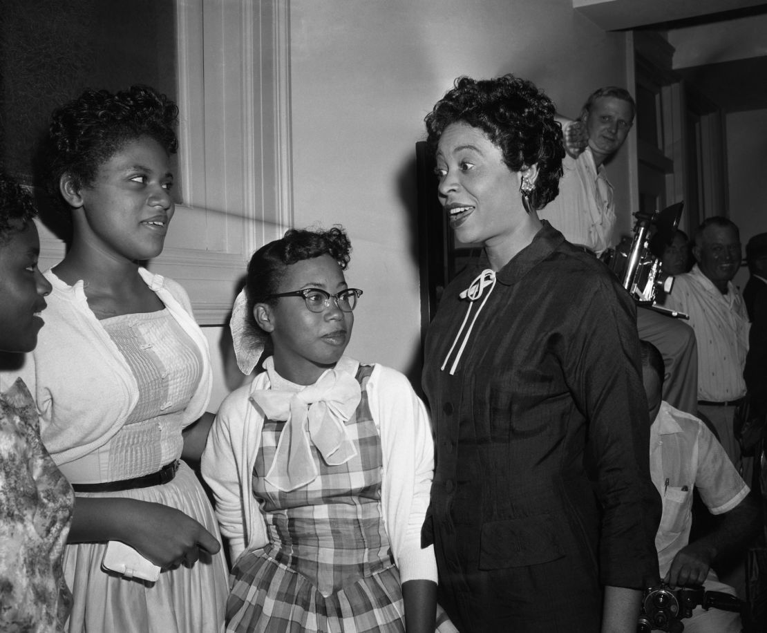 Minnie Brown, 15; Thelma Mothershed, 16; two of the nine negro students barred from the Little Rock Central High School and Mrs. L.C. Bates, president of the Arkansas chapter of the NAACP in court corridor.