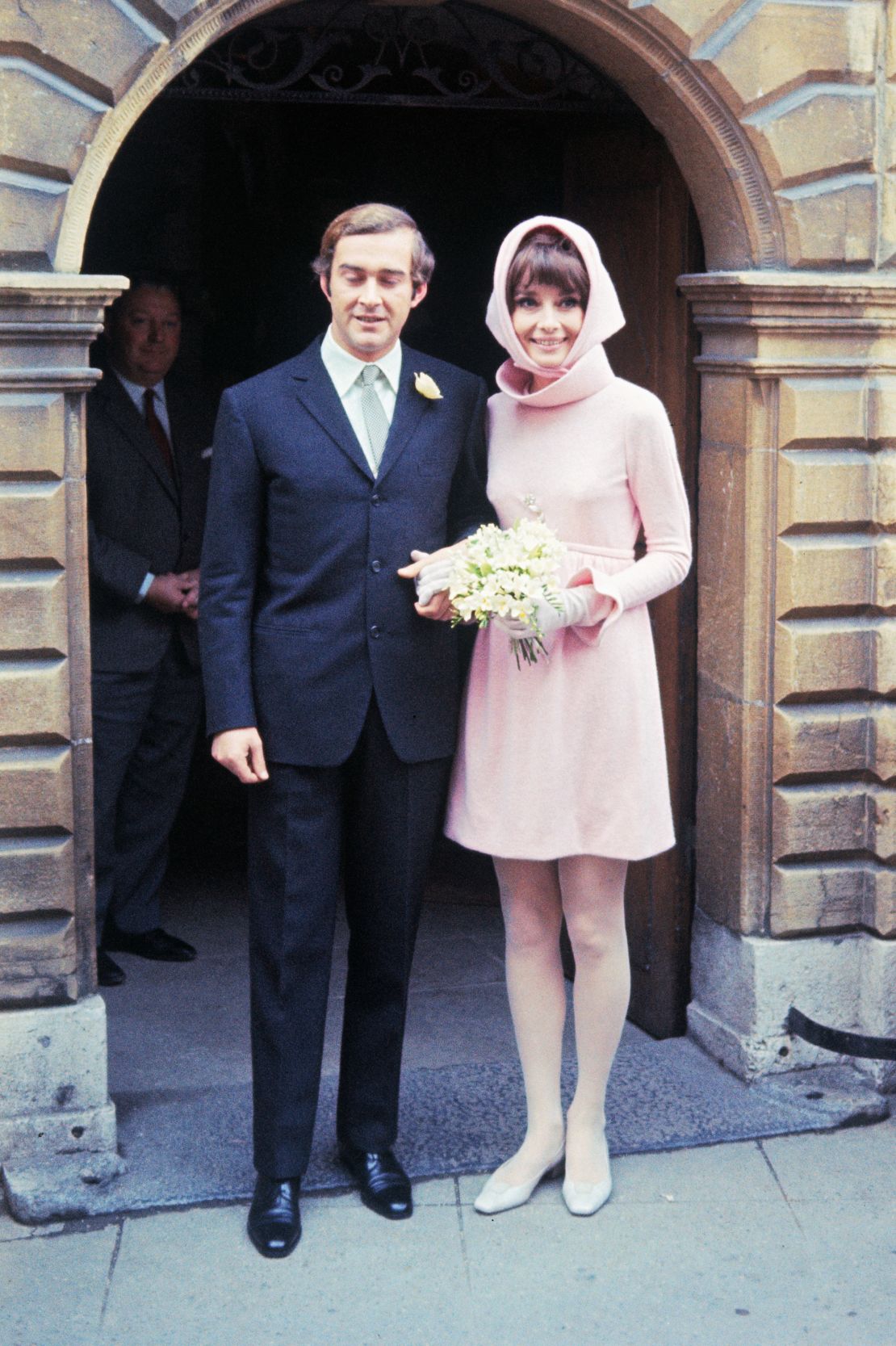 Audrey Hepburn wore a pink headscarf, matching her baby pink Givenchy mini dress, to marry her second husband, Italian psychiatrist Dr. Andrea Dotti, January 1969.