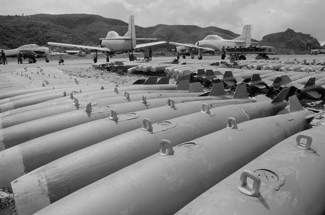 In this image taken in 1972, converted T-28 trainer aircraft stand near 250-pound bombs, part of the air arm of the CIA-sponsored
