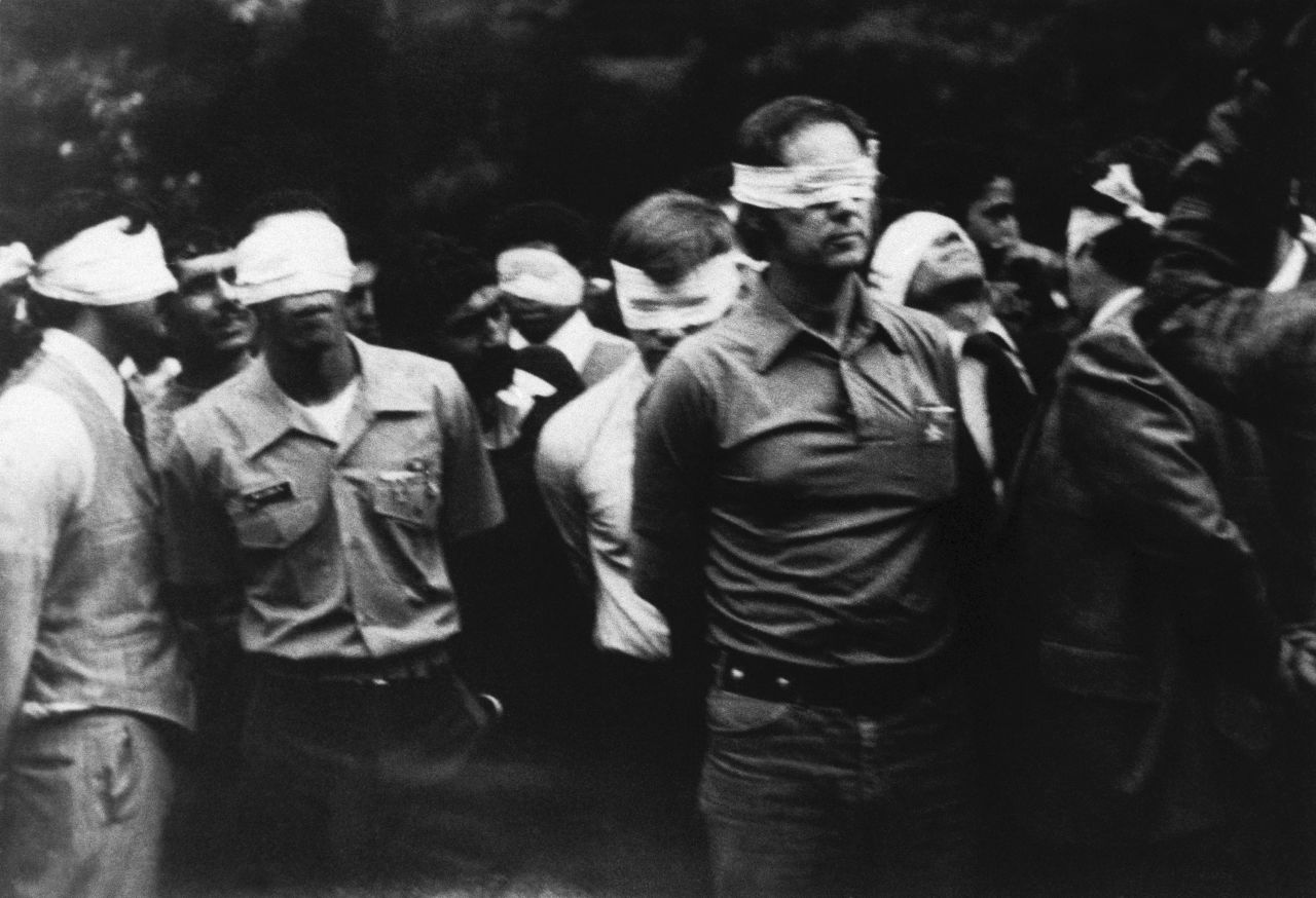 US hostages are seen inside the United States embassy compound in Iran blindfolded on November 4, 1979.